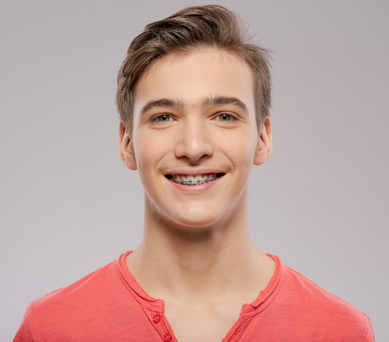 Young man with braces at Beverly Hills Orthodontics