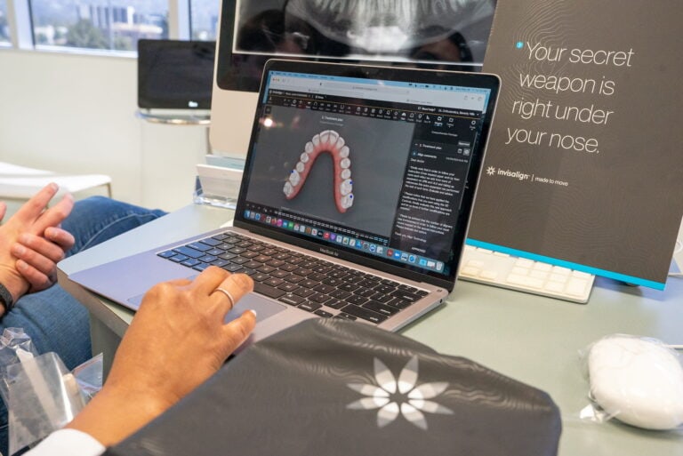A Beverly Hills Orthodontics Team member uses cutting-edge software to create a custom-made Invisalign solution for a patient.