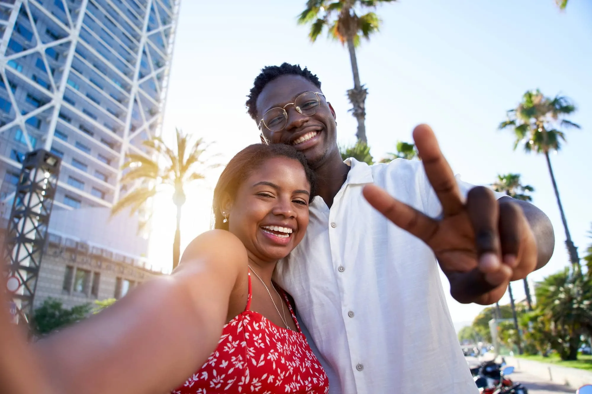 A young couple in Studio City shows off their gorgeous smiles after using Invisalign.