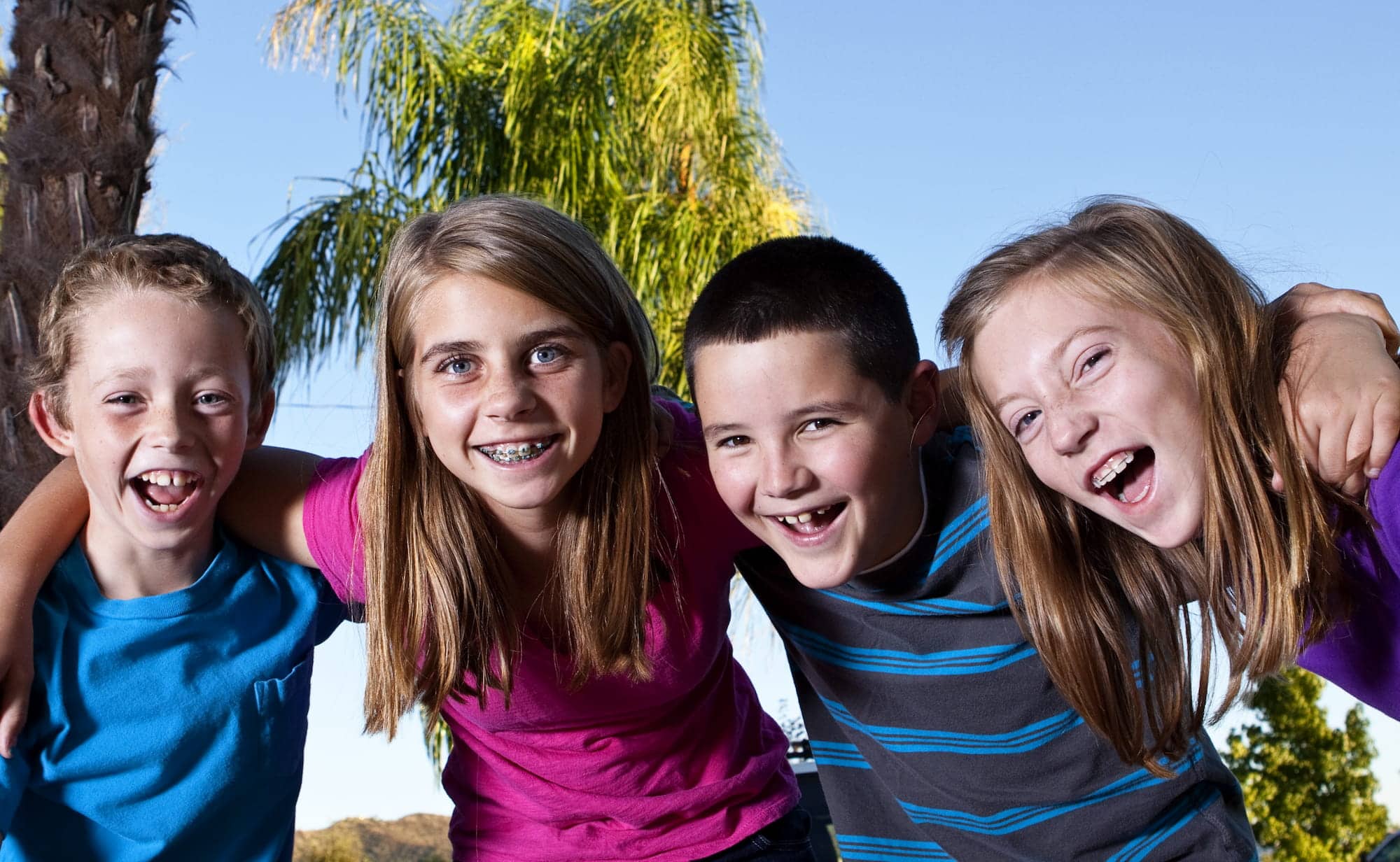 Kids with braces smiling and laughing