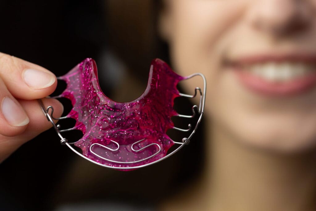 Permanent retainer vs. removable retainer options to maintain your new smile