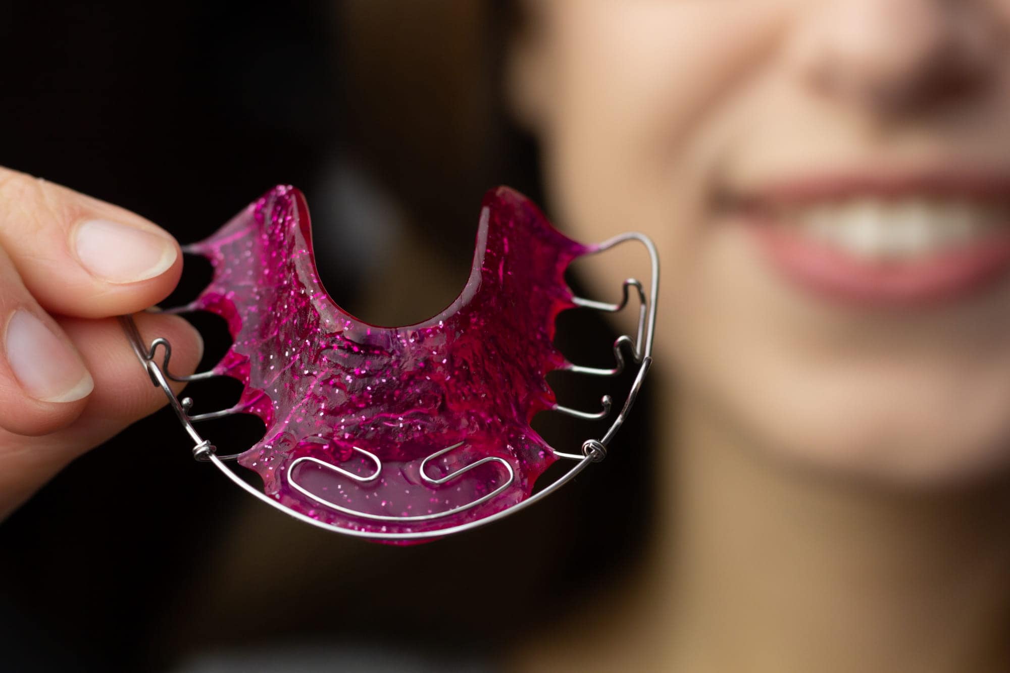 Permanent retainer vs. removable retainer options to maintain your new smile